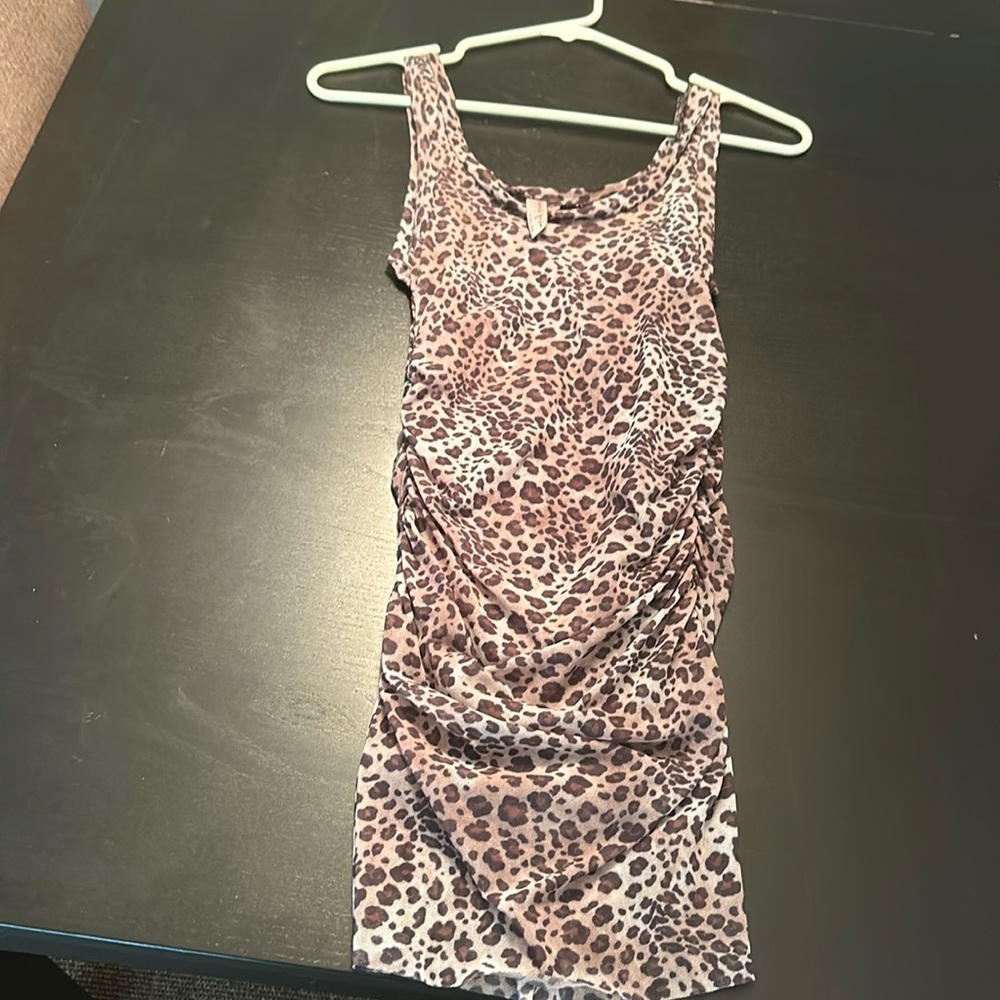 Sweet Pea cheetah print mesh tank top with Rouging on each side